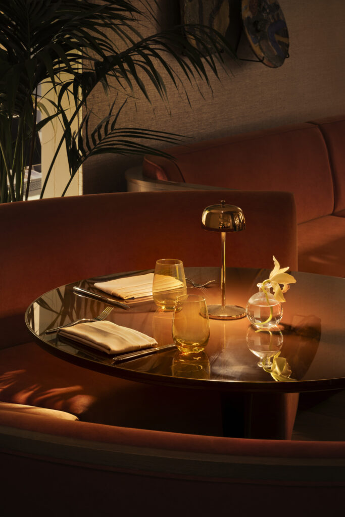 Romantic table setting with lamp and flowers