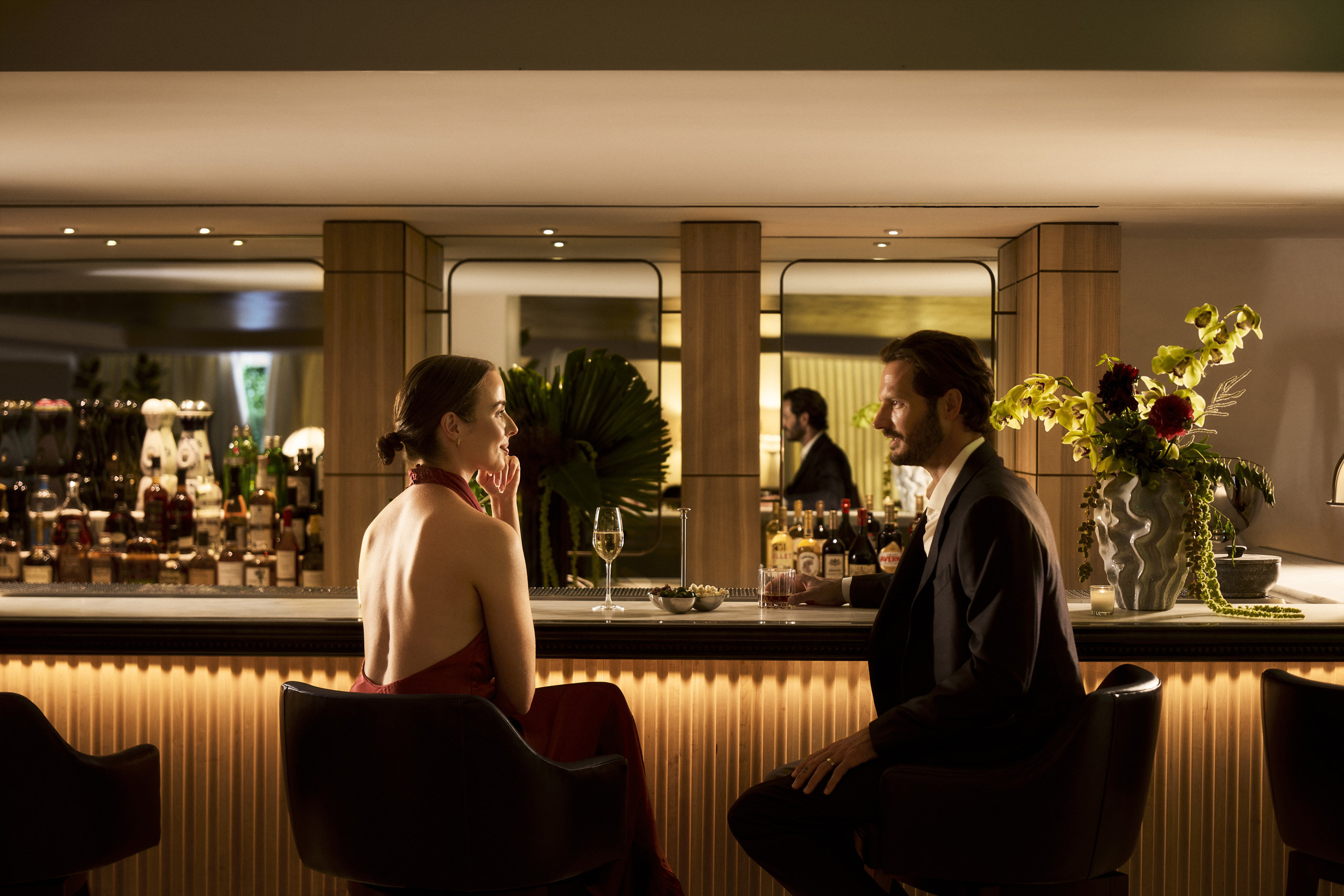 Couple enjoying cocktails at an elegant hotel bar