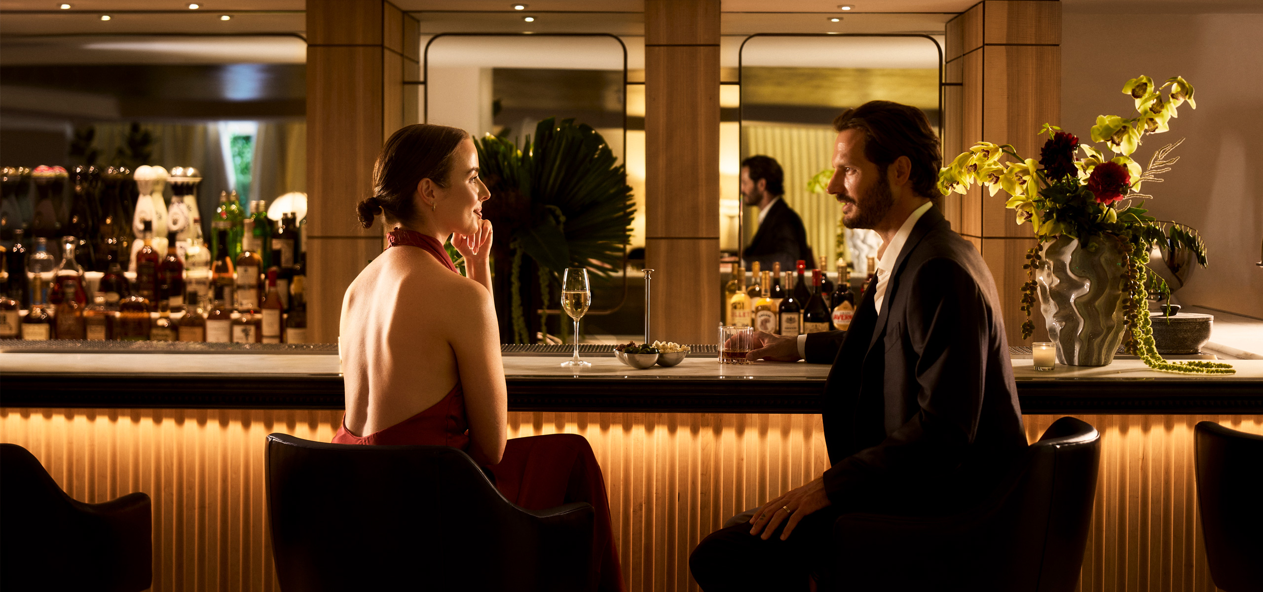 Couple enjoying cocktails at an elegant hotel bar
