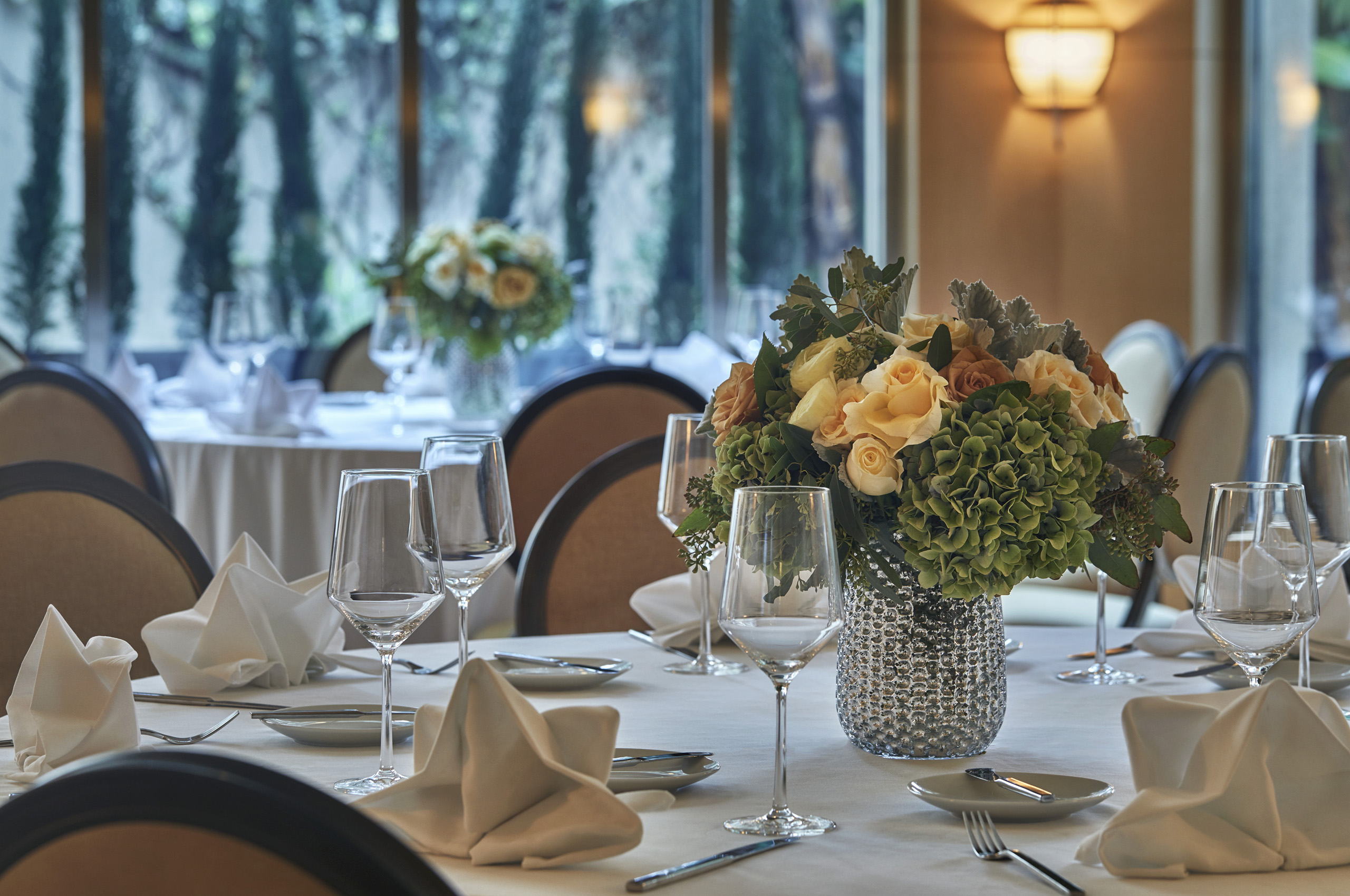 Elegant banquet table with floral centerpiece and wine glasses