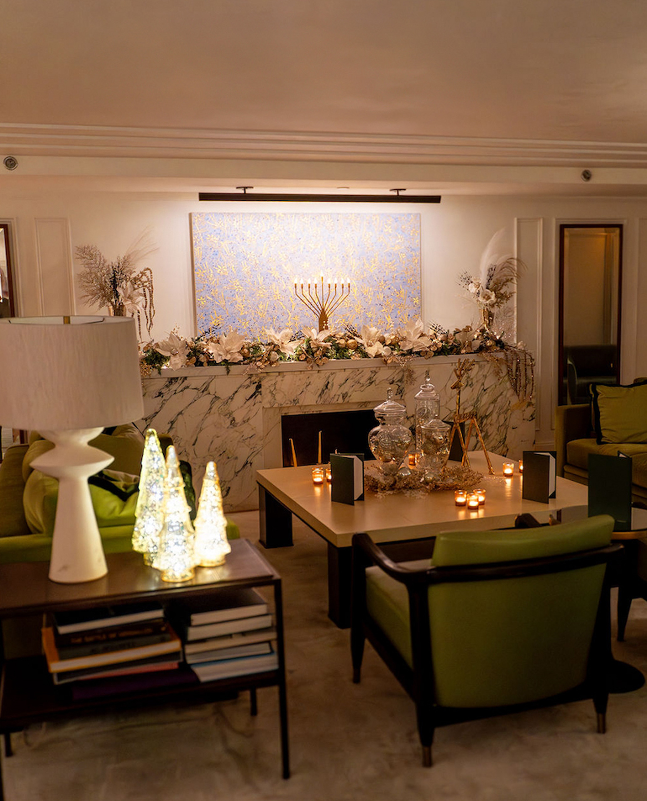 Cozy lounge with candles and holiday mantel decor