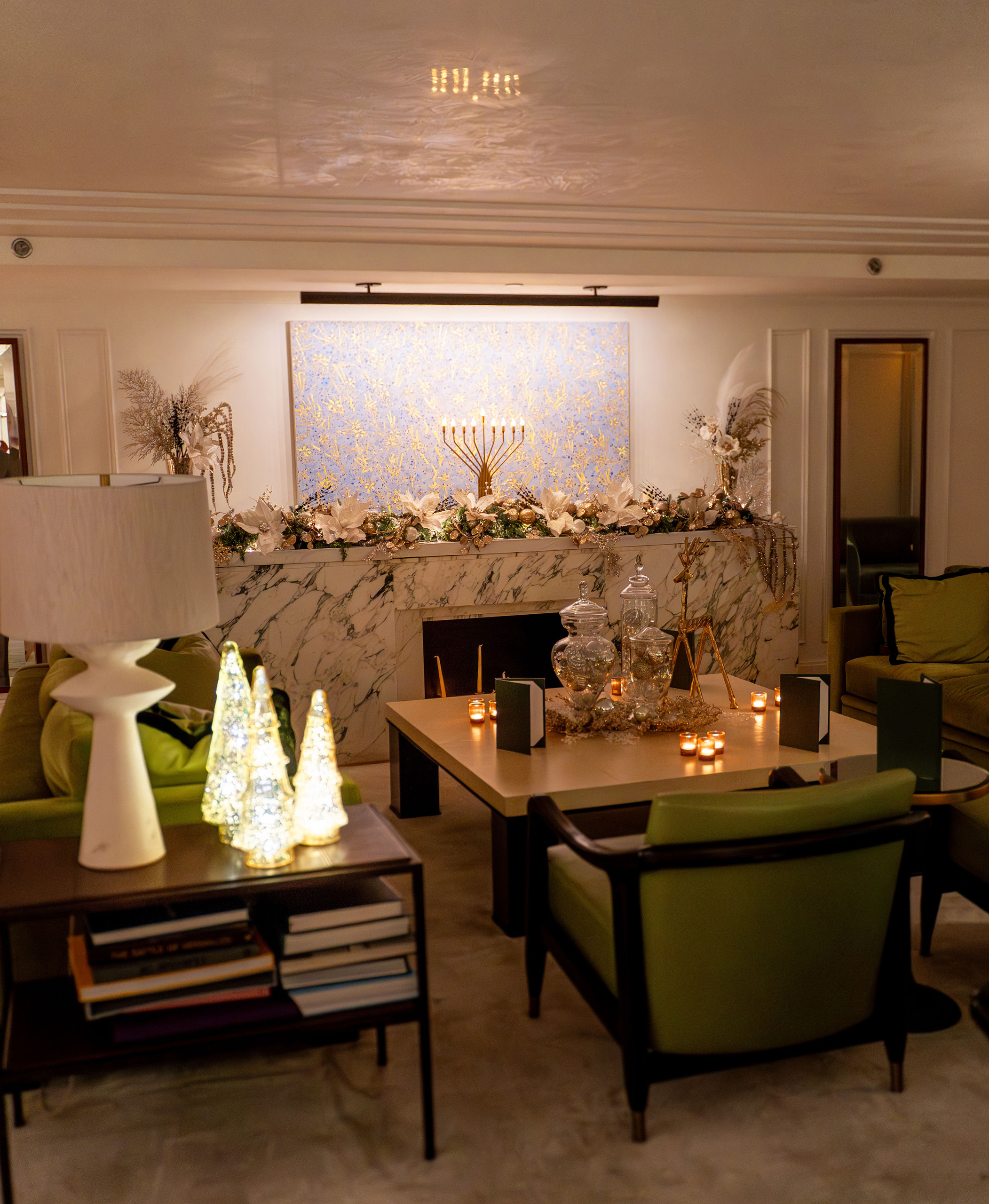 Holiday lounge scene with menorah and candlelit table
