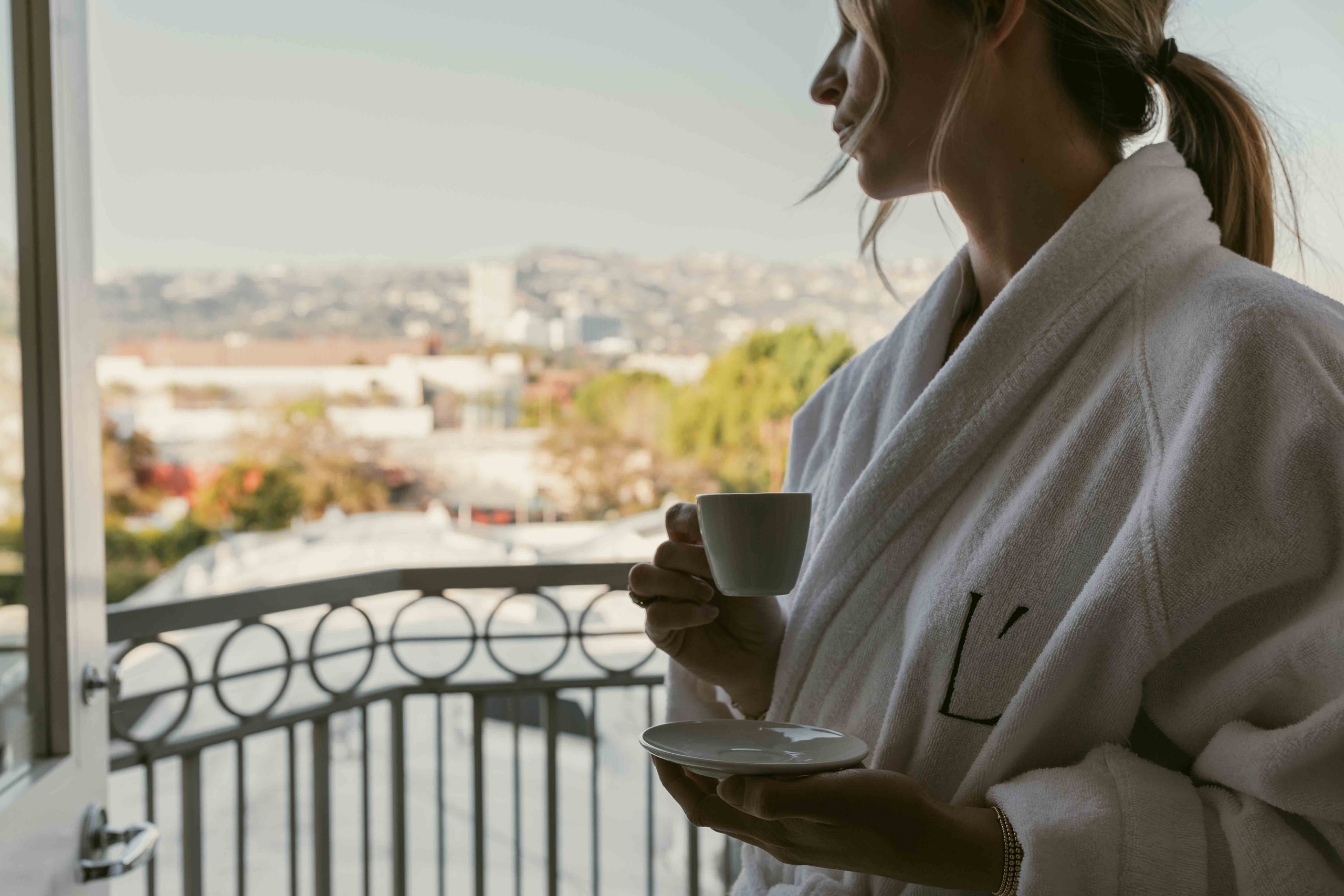 Guest enjoying coffee overlooking Beverly Hills