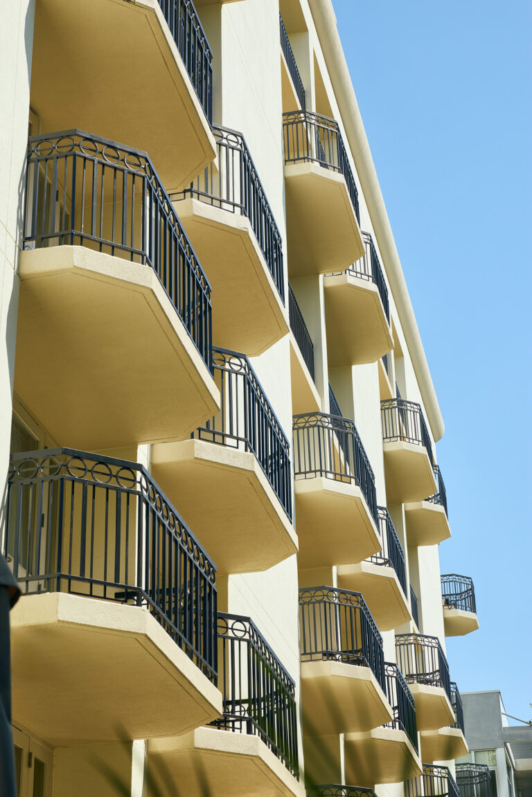Balcony façade against clear blue sky