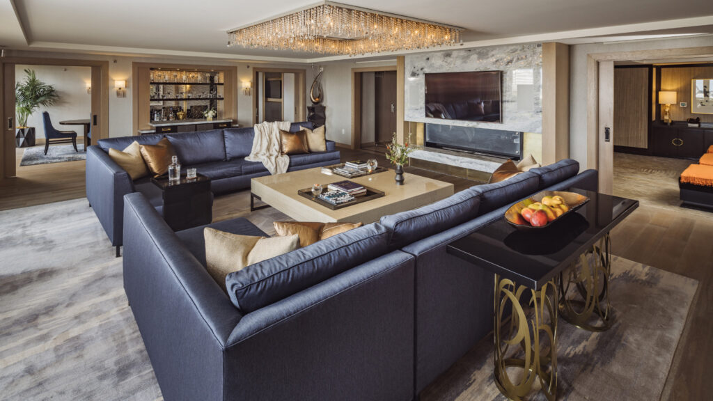 Spacious living room with plush sectional seating and elegant finishes