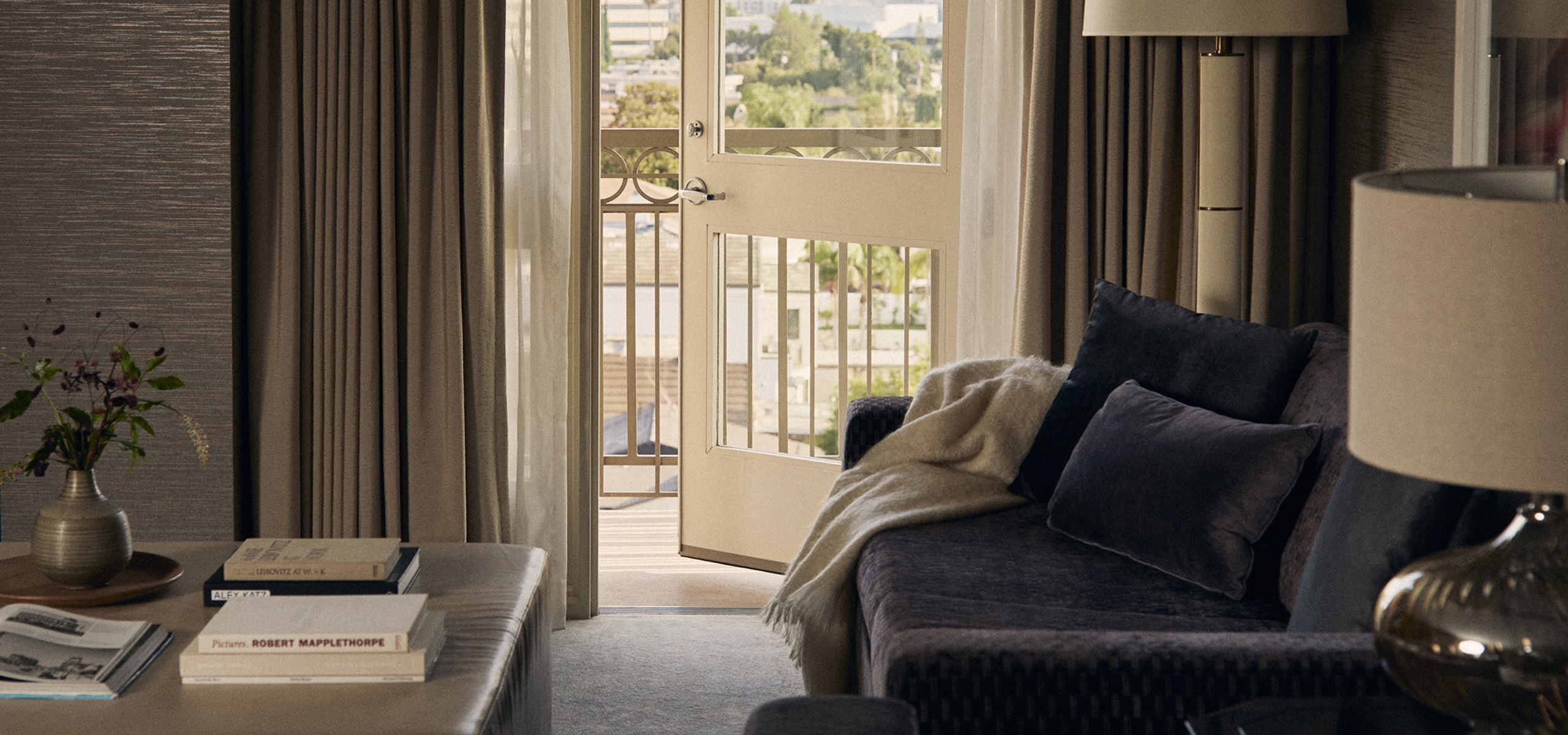 Elegant living area with balcony and city views