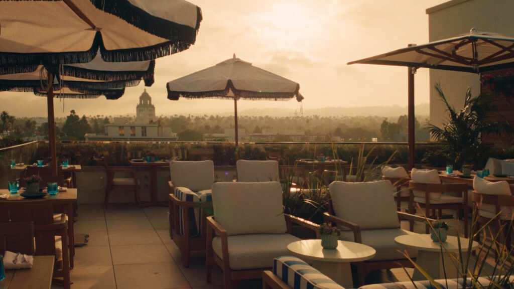 Rooftop lounge at golden hour overlooking the city