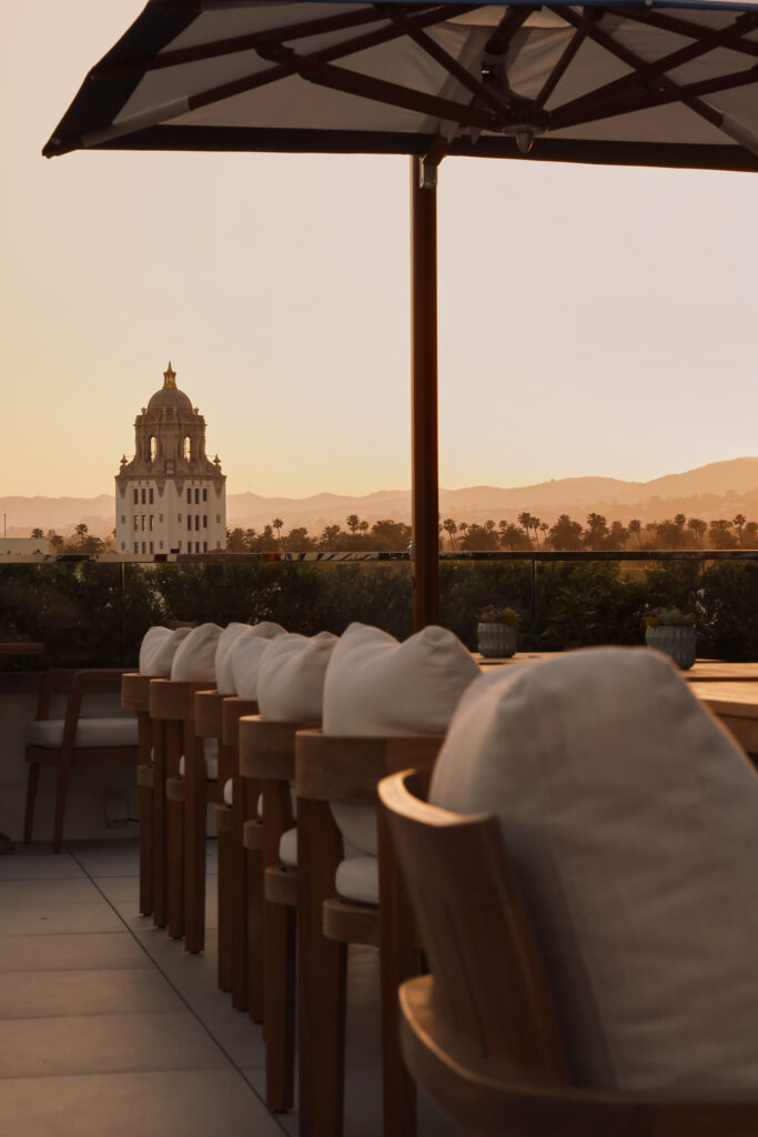 Sunset view from rooftop bar seating area.