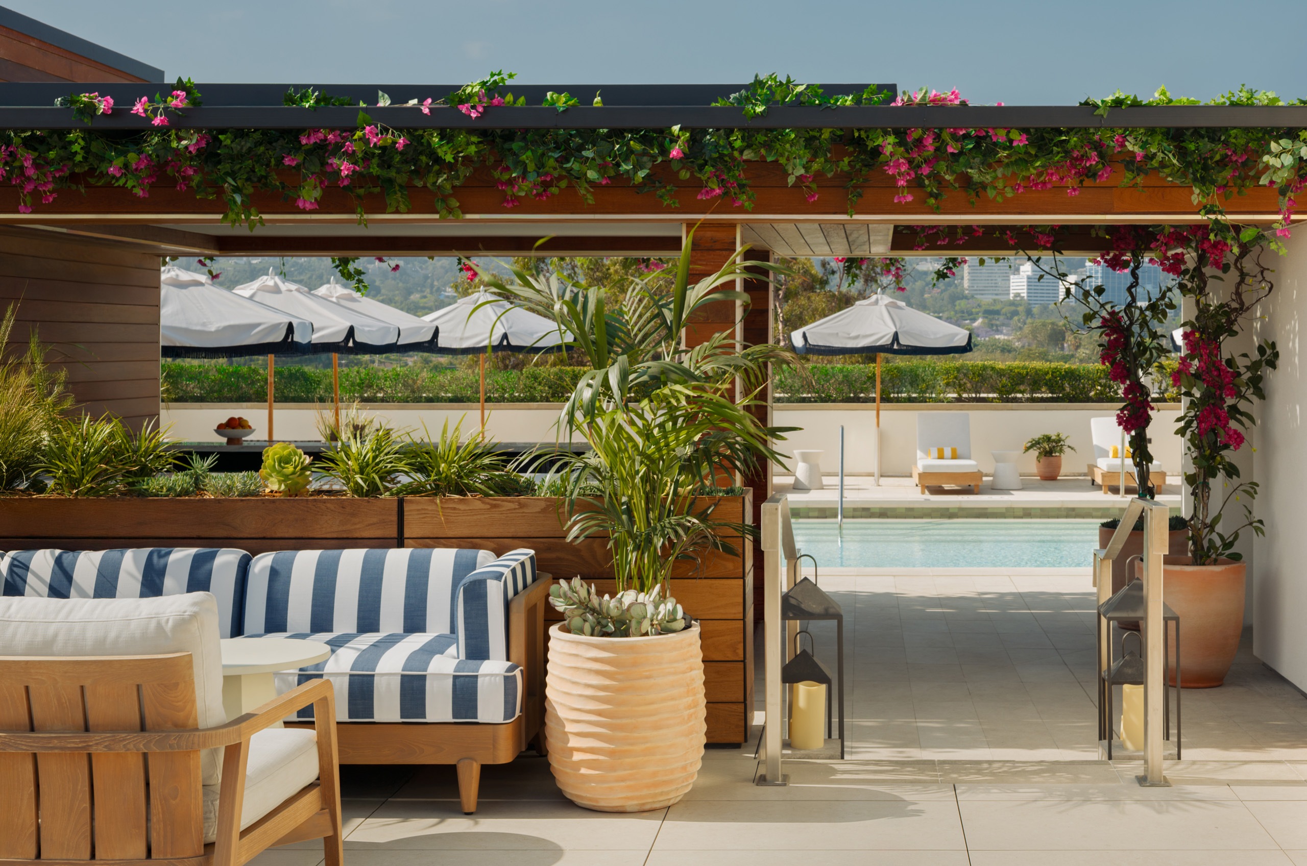 Terrace walkway opening from the dining area toward the rooftop pool