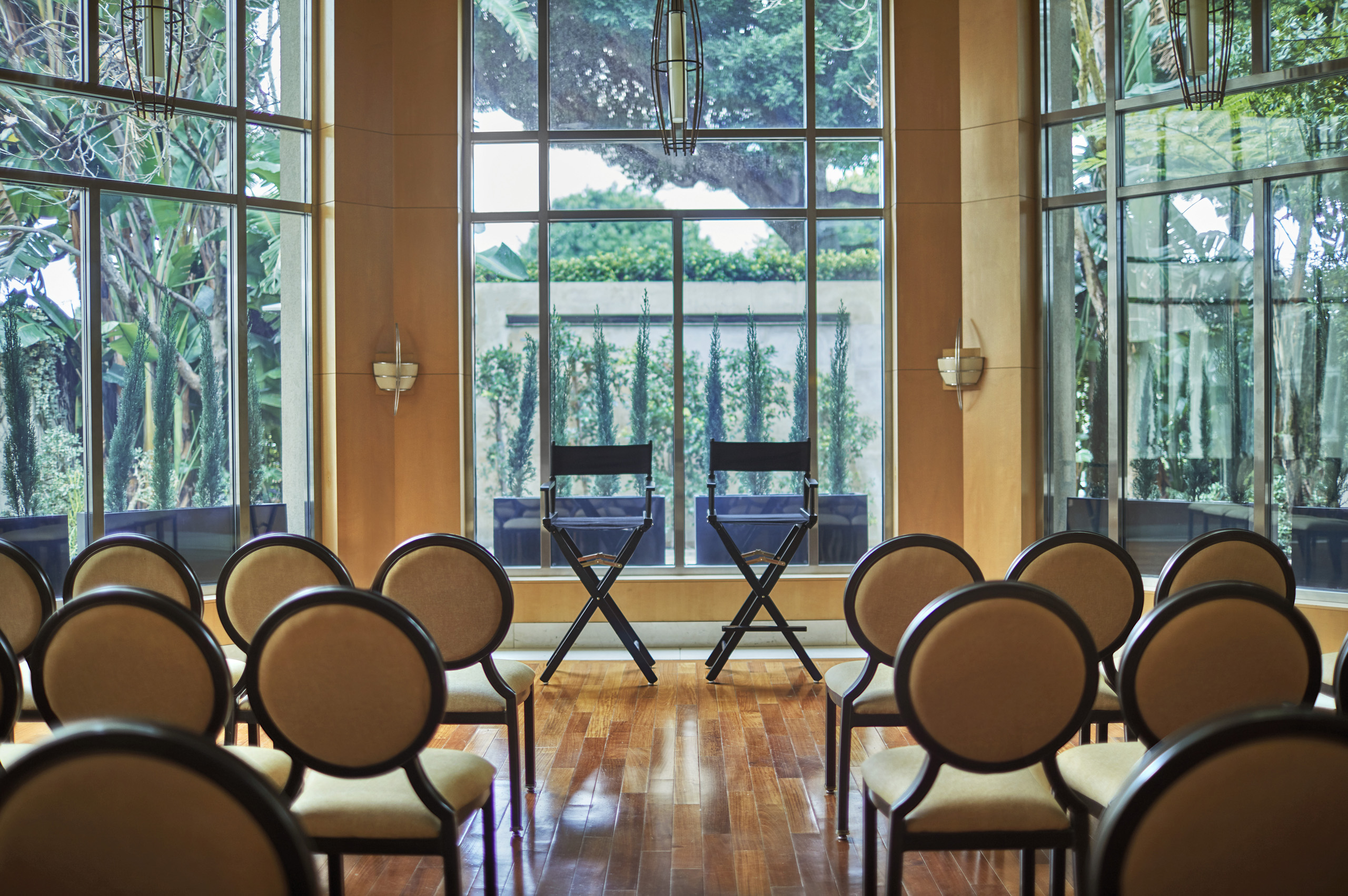 Theater-style seating facing front in bright rotunda.