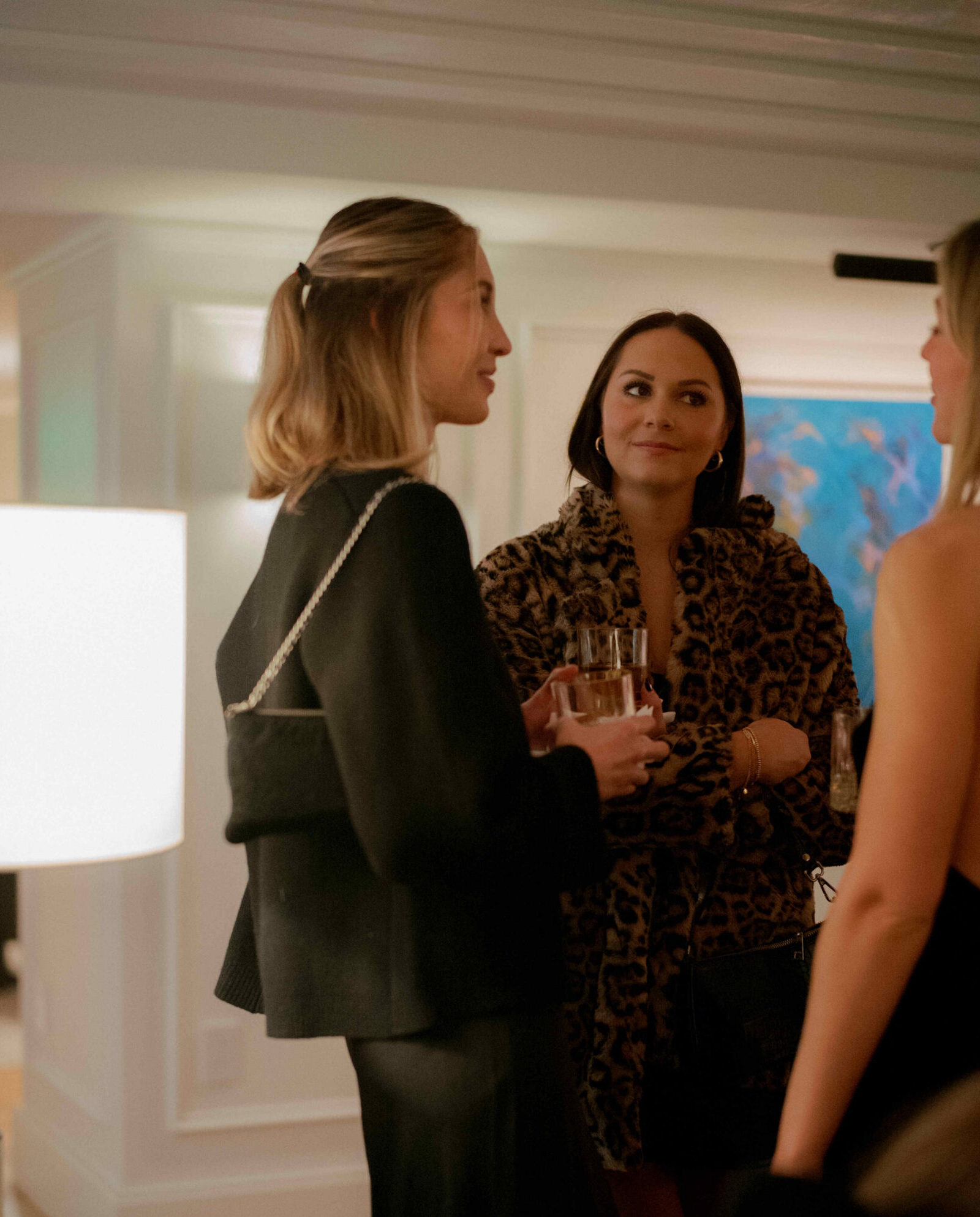 Women with cocktails in their hands at a brand activation in Alcova lounge